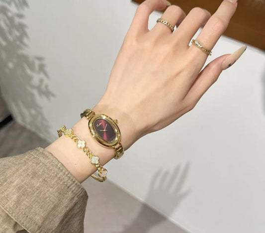Luxury Women's Red Dial Watch with Gold Bracelet - Fashionable Oval Design Wristwatch