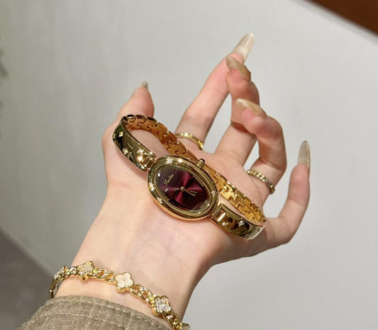Luxury Women's Red Dial Watch with Gold Bracelet - Fashionable Oval Design Wristwatch